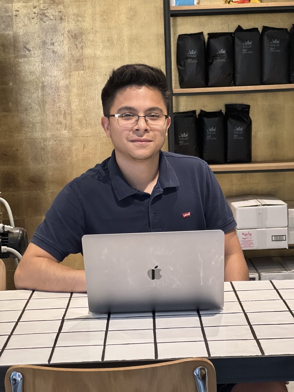 Brayan working from a café in Europe